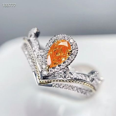 Crown Yourself in Luxury with Our Champagne Diamond Ring Elevate your elegance with our 18k gold princess crown ring featuring a stunning natural champagne diamond. Perfect for those who revel in rare, luxurious finds. Why Choose This Ring? Exquisite Main Stone: 0.3ct Fancy Vivid Orange Yellow diamond, showcasing a unique and captivating hue. Elegant Design: Accented with 0.239ct of side stones, crafted in 3.07g of 18k gold. Perfect Fit: Adjustable size for personalized comfort and style. ... Gold Princess Crown, Orange Crown, Princess Crown Ring, Yellow Champagne, Champagne Diamond Ring, Crown Ring Princess, Orange Diamond, Champagne Diamond Rings, Crown Ring