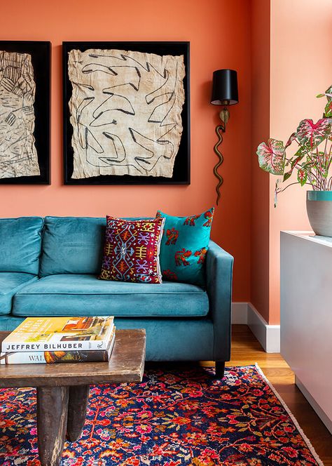 Harlem curated color Orange And Blue Interior, Coral Living Rooms, Coral Room, Collaborative Space, Black Painted Furniture, Deco Orange, Hallway Colours, Teal Sofa, Coral Walls