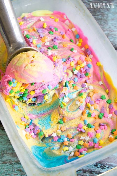 Unicorn Ice Cream is magic on a cone! There's nothing better on a hot day than rainbow ice cream that's covered in star sprinkles and glitter! Bread Booze Bacon, Unicorn Ice Cream, Pastel Cupcakes, Rainbow Ice Cream, Star Sprinkles, Rainbow Food, Unicorn Foods, Ice Cream Popsicles, Crazy Cakes