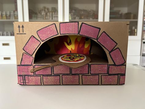 DIY Cardboard Pizza Oven For Kids | Rachael Ray Show Diy Play Pizza Oven, Cardboard Pizza Craft, Pizza Crafts For Kids, Cardboard Pizza Oven, Kids Oven, Diy Oven, Pizza Craft, Stone Pizza Oven, Oven Diy