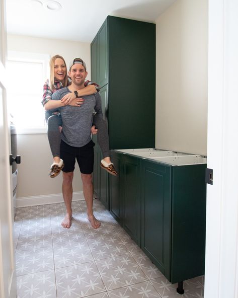 Come learn our tips for installing IKEA kitchen cabinets and making them look high-end and built-in. We used these dark green cabinets in our laundry room and they turned out absolutely gorgeous! #IKEA #ikeakitchen #DIYkitchencabinets Ikea Laundry Room Cabinets, Ikea Laundry, Diy Laundry Room Makeover, Ikea Laundry Room, Used Kitchen Cabinets, Wood Wall Bathroom, Ikea Kitchen Cabinets, Diy Playbook, Laundry Room Cabinets