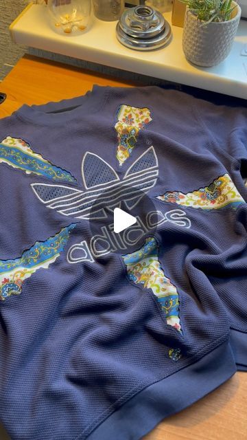 sewitagain on Instagram: "sew upcycle rework repeat ♻️ Old #adidas sweatshirt combined with vintage curtain Method: Reverse Appliqué ✨ 💙Blue collection sweatshirt No. 3 • #reworked #reworkedclothing #reworkedfashion #sustainablefashion #upcycledclothing #upcycledfashion" Reverse Applique Sweatshirt, Upcycling Sweatshirt, Applique Sweatshirts, Reworked Tshirt, Embroidered Sweatshirt Diy, Sew Upcycle, Old Adidas, Sweatshirt Upcycle, Reworked Sweatshirts