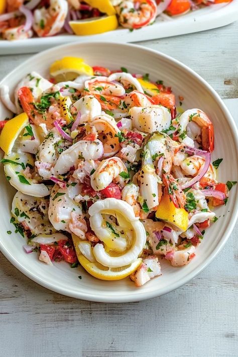 Fresh, zesty, and bursting with flavors from the sea, this Italian seafood salad is a perfect blend of shrimp, calamari, and fresh herbs. Drizzle with lemon and olive oil for a refreshing bite of Mediterranean magic. Whip up something special – get the recipe now #SeafoodSalad #ItalianRecipes #HealthyMeals #MediterraneanCuisine #FreshSeafood #EasyRecipes #DinnerInspo #ItalianFlavors #QuickMeals #SeafoodLovers Seven Fishes Seafood Salad, Italian Calamari Salad, Spanish Seafood Salad, Italian Fish Salad, Healthy Seafood Salad, Italian Sea Food, Seafood Blend Recipes, Mediterranean Seafood Recipes, Christmas Dinner Seafood