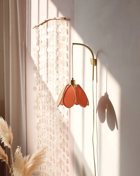 We offer you an elegant and graceful wall support to install your flower lamps. The support is sold with our small flower lampshade, covered with an ocher colored fabric. We designed this support by imagining a minimalist and very easy to use fixing system, to highlight our small lampshades flowers. It is made in Portugal, in brushed brass. It attaches to the wall with two screws. The electric cord can be adjusted according to your need, you can let it fall forward as you like. An installation g Corded Wall Lights, Hanging Lamp Decor, Ceiling Lights For Hallway, Apartment Friendly Lighting, Flower Wall Light, Flower Wall Lamp, Sconces Above Couch, Wall Lamp Ideas, Unique Pendant Lighting