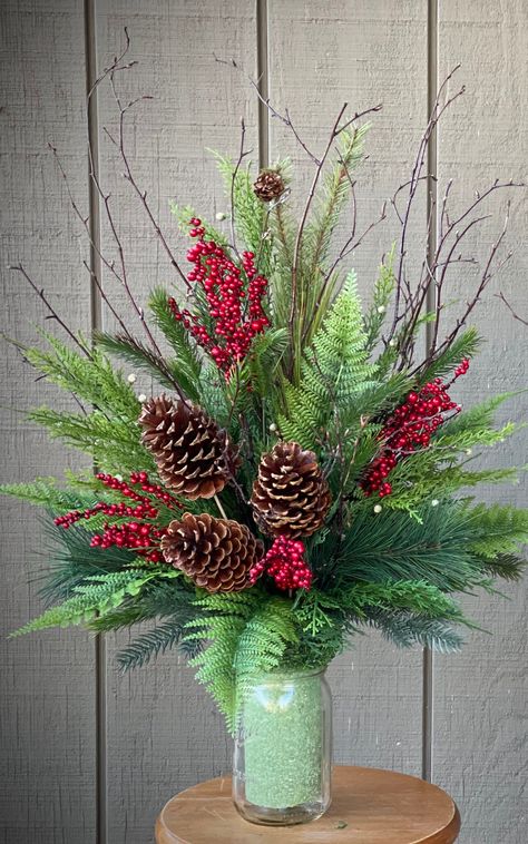 Beautiful Deluxe Rustic and Natural Christmas Mixture  consisting of Lush Pine, Cedar, Ruffle Fern, Pine cone, and Red Berries and Birch Branches.  Vase Styrofoam Insert. The Insert measures 8" tall and 3.25" wide. Total arrangement stands approx 22-24" tall.  please note that each one is hand made and will vary slightly in design. mason jar in the photos  is not included. Christmas Floral Arrangements For Cemetery, Cemetery Urn Arrangements, Cemetery Winter Decorations, Winter Grave Flowers, Christmas Cemetery Arrangements, Christmas Grave Wreaths, Decoration Flowers For Cemetery, Christmas Flowers For Cemetery Vases, Cemetary Flower Ideas