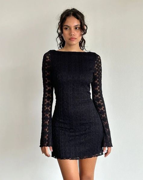 In a black regal lace, the Sevila dress features a mini, bodycon silhouette with long, flared sleeves and a boat neckline. Complete with scalloped hem detailing on a fully lined body. Lace Top Mini Dress, Short Long Sleeve Dress, Long Sleeve Dress Lace, Lace Long Sleeve Mini Dress, Sabrina Neckline, Motel Rocks Dress, Black Bell Sleeve Dress, Long Sleeve Black Dress, Black Dress With Lace