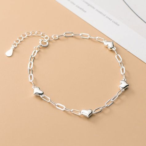 Description & Details Dolce Jewellery, Love Link Chain Bracelet. One piece, endless opportunities. In a minimalist design, this chain-link bracelet from Dolce Jewellery features cute tiny love hearts and is perfect for everyday accessorizing. All your jewellery needs met. Available only in one color: Silver. Product Type: Bracelets Product Name: Love Link Chain Bracelet Material: 100% 925 Sterling Silver Lengths: bracelet length is 15cm (5.9 inches), extension chain length is 3cm (1.2 inches Bracelet One Piece, Thigh Jewelry, Argentium Silver Jewelry, Bracelet Packaging, Daily Wear Jewellery, Korean Jewelry, Gold Rings Fashion, Link Chain Bracelet, Sweet Lady