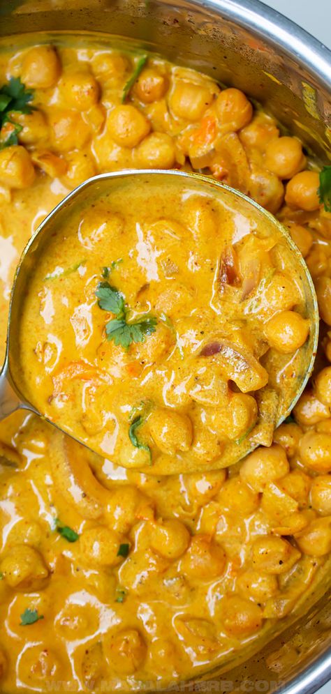 Creamy Coconut Chickpea Curry Recipe - lightly spiced prepared with coconut milk, this vibrant and wholesome curry is sure to make you feel amazing. This is a one pot vegan dinner meal idea inspired by Indian curries. www.MasalaHerb.com Creamy Indian Curry, Chickpea And Coconut Milk Recipes, Coconut Curry Chickpea Soup, Coconut Chickpea Curry Crockpot, Chickpea Potato Curry Coconut Milk, Chickpea Korma Curry, Coconut Milk Indian Recipes, Chick Pea Recipes With Coconut Milk, Beans And Coconut Milk