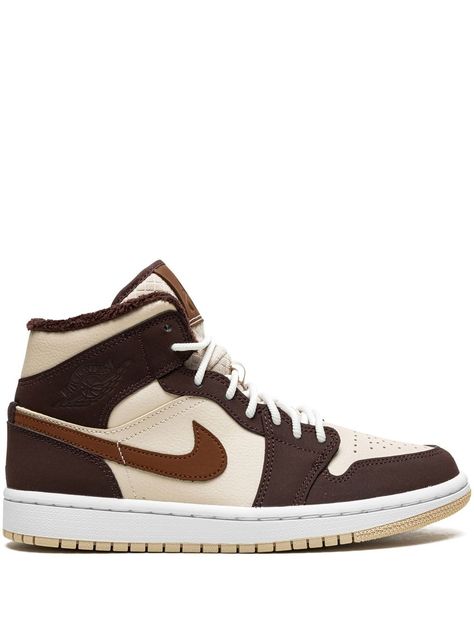 Air Jordan 1 Mid SE sneakers from JORDAN featuring brown, light brown, leather, panelled design, ankle-length, branded insole, flat rubber sole, front lace-up fastening and ankle-length. These styles are supplied by a premium sneaker marketplace. Stocking only the most sought-after footwear, they source and curate some of the most hard to find sneakers from around the world.. | Jordan Mid SE sneakers Jordans Burgundy, Air Jordan Brown, Brown Air Jordan 1, Brown Jordans, Jordans Brown, Brown Jordan 1, Brown Nike Shoes, Jordan Fit, Nike Jordan Air 1