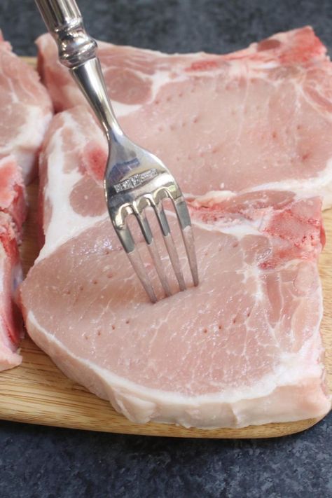 Closeup of piercing the pork chops with a fork. Pork Chop Brine Recipes Simple, Meat Tenderizer Recipe, Pork Brine Recipe, Pork Chop Brine Recipes, Brine For Pork, Pork Chop Brine, Brine Recipes, Pork Crock, Delicious Salad Recipes