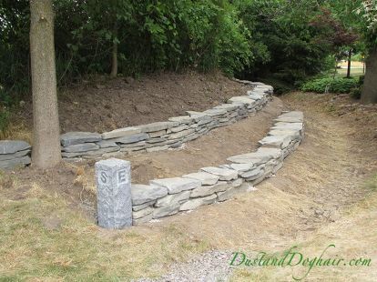 diy stacked stone garden wall, concrete masonry, landscape, outdoor living Retention Wall, Stone Garden Wall, Sister Tats, Cottage Patio, Stone Walls Garden, Hill Landscape, Stacked Stone Walls, Rustic Landscaping, Sloped Yard