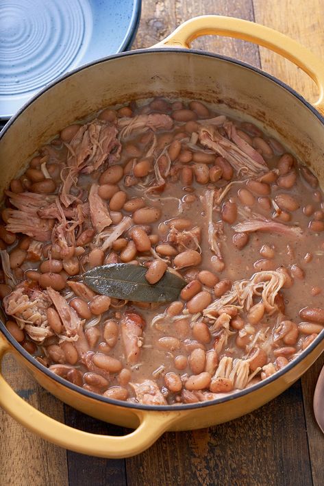 Dutch oven filled with cooked pinto beans and shredded turkey leg. My Forking Life, Turkey And Beans Recipe, Smoked Turkey And Bean Soup, Smoked Turkey And Beans, Crockpot Pinto Beans With Smoked Turkey, Beans And Turkey Necks, Southern Pinto Beans In The Crock Pot, Pinto Bean Recipes Southern, Best Pinto Bean Recipe