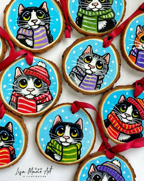 These handmade Christmas tree decorations are the PURRfect festive decor for cat lovers! Each one has been hand painted, making them all unique, and made from rustic wood slices with a festive red satin ribbon for hanging. These festive tree decorations feature tuxedo cats, grey tabbies, and ginger tabby cats wearing hats and scarves, some just wear bobble hats!. Choose the one you want from the drop down menu. * All unique and only 10 available * Natural wooden slice with bark * Hand painted using acrylic paint * Approx 7cm in diameter * Red satin ribbon for hanging * signed and dated with year on reverse side Coated with an artist grade anti-UV satin varnish on the painted side for extra protection. The natural wood and hand painted nature of this product means that there will be imperfe Hand Painted Christmas Tree On Wood, Hand Painted Xmas Ornaments, Unique Christmas Tree Ornaments, Personalized Wood Slice Ornaments, Painted Log Slice, Christmas Cat Decorations, Christmas Wooden Ornaments Painted, Cat Christmas Decorations, Painted Wood Circles