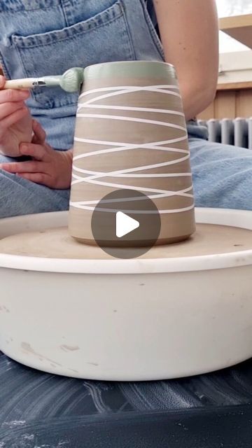 Sira Ceramics on Instagram: "jazzing up a wine cooler – taping and applying slip  #ceramics #pottery #potterypassion #wheelthrown #claywork #winecooler #winelover" Slip Glazed Pottery, Pottery Tape Resist, Wax Resist Pottery Ideas, Underglazing Pottery, Using Tape To Glaze Pottery, Slip Design Ceramics, Tape Resist Pottery, Slip Painting Ceramics, Coloured Slip Pottery