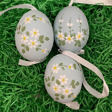 "Handmade from a real chicken egg, this egg ornament features daisies hand painted on a pale blue egg.  Egg measures approximately 2-1/4\" tall with a 2-3/4\" ribbon hanger.  Handmade in Slovakia using traditional methods for handcrafting Eastern European Easter eggs.  Flowers differ slightly, please let us choose for you" Eastern Eggs, Easter Baby Photos, Creative Easter Eggs, Easter Paintings, Easter Egg Art, Eggs Flowers, Easter Craft Decorations, Easter Egg Designs, Easter Eggs Diy