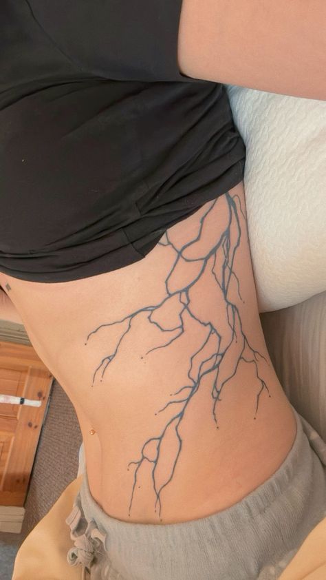 Lightning Tattoo Side Rib, Lightning Side Tattoo, Lightning Tattoo Stomach, Struck By Lightning Tattoo, Lightning Tattoo Women Ribs, Lighting Strikes Tattoo, Lightning Rib Tattoo, Lighting Arm Tattoo, Lightnight Bolt Tattoo