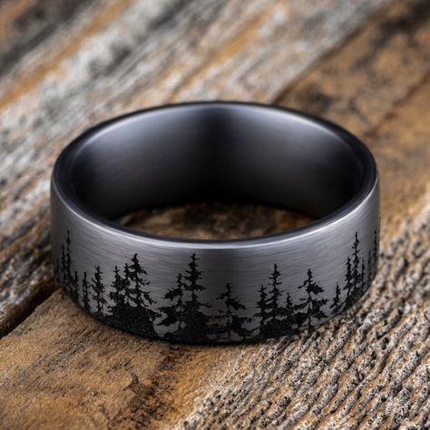 A striking forest-inspired motif rings the circumference of this handsome men's wedding band. Fashioned in tantalum, the inside of the ring is lined with smooth black tantalum to complete the look. The band features Comfort-Fit, which gives a narrower feel than it's actual width when worn. Comfort-Fit rings are designed to have a slightly rounded inside surface so less of the metal touches your finger, which enhances the feel of the ring while wearing and sliding it on and off your finger. Groom Wedding Band, Nature Wedding Ring, Antler Wedding Band, Mens Black Ring, Groom Ring, Mens Wedding Bands Tungsten, Tungsten Wedding Rings, Titanium Wedding Band, Jared The Galleria Of Jewelry