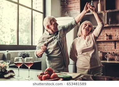 Beautiful senior couple is dancing and smiling while cooking together in kitchen Couple Baking, Baking Photoshoot, Best Would You Rather, Older Couple, Would You Rather Questions, Dream Future, Elderly Couples, Reverse Mortgage, Old Couples