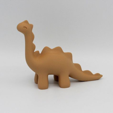 Add prehistoric charm to your space with our adorable dinosaur figurine. This charming desk or decoration piece features a delightful design, bringing a touch of whimsy to any room. Crafted with attention to detail, it's a perfect addition for dino enthusiasts and a conversation starter for all. Get transported back in time.  Features: 1️⃣ Adds a perfect flair to any dinosaur lovers desk, home or office. 2️⃣ Made using 100% renewable energy in Beaverton, Oregon. 3️⃣ Compact size: fits any displa Simple Ceramic Sculpture, Cute Clay Dinosaur, Diy Clay Dinosaur, Air Dry Clay Dinosaur, Dinosaur Clay Sculpture, Airdryclay Ideas Simple, Dinosaur Pottery, Clay Dino, Clay Dinosaur