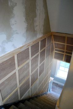 When you have a stairway with lots of damage, you have to be ready to deal with lots of repair. Or you have to get creative. In our case, we got creative. We chose to install a type of board and batten on the staircase to create an upscale look, and to avoid all the wall repair … Square Board And Batten, Stairway Walls, Basement Staircase, Basement Decoration, Basement Remodel Diy, Staircase Remodel, Staircase Wall, Decor Fireplace, Basement Stairs