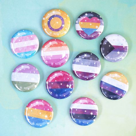 Dreamy Pride Pins! Tell them who you are with these pretty pride flag pins featuring a starry illustration and subtle texture by our talented artist Schlady! Choose from: Asexual, Nonbinary, Lesbian, Genderfluid, Trans, Genderqueer, Pansexual, Panaromantic, Intersex, Demi. About these pins: Size: 1.25" Traditional metal pinback button One per order Starry Illustration, Slay Nails, Lgbtq Icons, Lgbt Flags, Pride Pins, Lgbtq Stuff, Pan Pride, Pride Shoes, Pride Jewellery