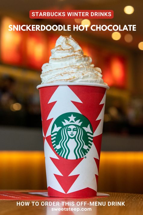 A Starbucks snickerdoodle white hot chocolate with cinnamon sugar sprinkles on top of whipped cream. Starbucks Snickerdoodle Hot Chocolate, Snickerdoodle Hot Chocolate Starbucks, Starbucks White Hot Chocolate Order, Best Holiday Starbucks Drinks, White Hot Chocolate Starbucks, Starbucks Hot Chocolate Drinks Orders, Snickerdoodle Starbucks Drink, Hot Chocolate Starbucks Drinks, Starbucks Secret Menu Drinks Winter