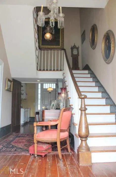 The Changing Look of the Newel Post, Part One: 1850 – 1939 | Architectural Observer Second Empire House, Entryway Stairs, Round Column, Handrail Design, Open Staircase, Revival Architecture, Old Houses For Sale, Newel Posts, Grand Homes