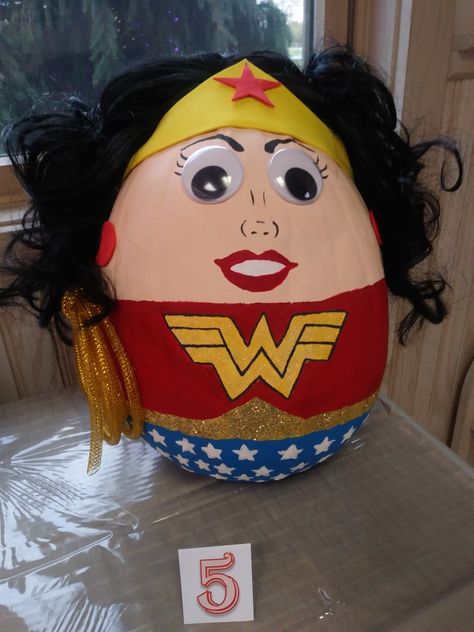 Wonder woman superhero pumpkin Superhero Pumpkins Decorating, Superhero Pumpkin Painting, Wonder Woman Pumpkin, Superhero Pumpkin, Bear Pumpkin, Woman Superhero, Wonder Woman Superhero, Pumpkin Paint, Fall Harvest Party