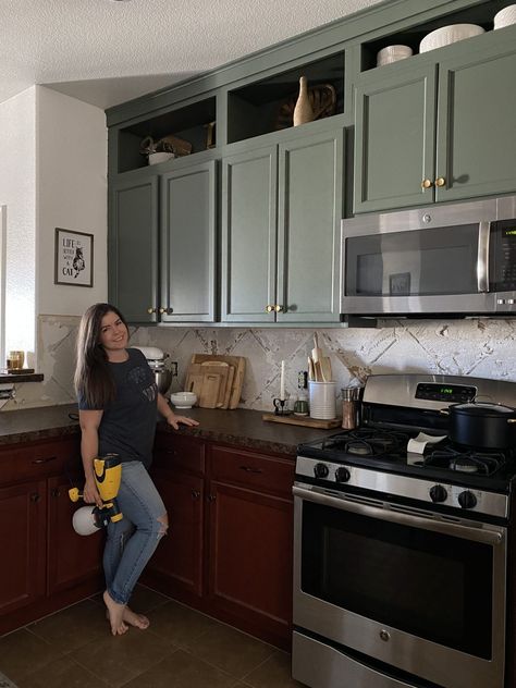 I Painted My Kitchen Cabinets Green! Painted Kitchen Cabinets Before And After Green, Olive Green Cabinet Colors, Green Base Kitchen Cabinets, Half Wood Half Painted Cabinets, Green Brown Kitchen Cabinets, Painted Upper Kitchen Cabinets, Kitchen Cabinet Color With Black Countertops, Dark Green Cabinets Black Hardware, Cherry Cabinets Green Island