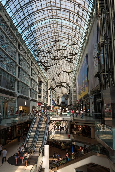 Shopping Mall in Toronto, Canada. Toronto, Canada - September 5, 2015: Inside view of a modern shopping mall (Eaton Centre) in Toronto's city centre, full of stock photos Shopping Mall Photography, Toronto Mall, Toronto Canada Aesthetic, Eaton Centre Toronto, Modern Shopping Mall, Mall Photography, Fantasyland Hotel, Toronto View, Canada Toronto City