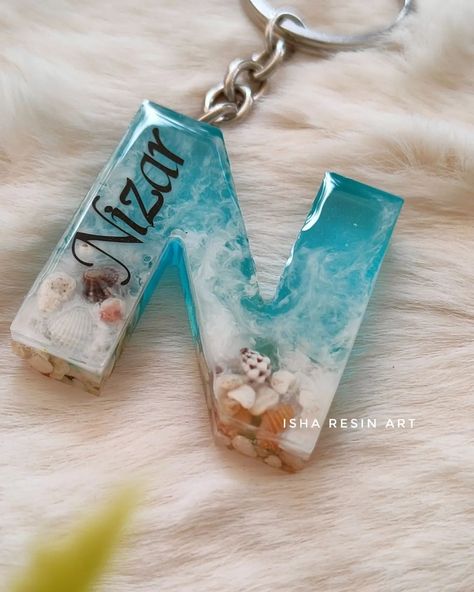 Alphabet name keychain in ocean theme 🩵 #customizedproducts #resin #resinartistsofinstagram #resincreations #keychaincollection #alphabet #namekeychains #handmadekeychains #oceantheme #oceancreatures #letterN#cutethings #customisedwork (Resin, resinart, keychains, namekeychain, customized keychains,letterN) Resin Art Alphabet Keychain, Resin Name Keychain, Alphabet Resin Keychain, Alphabet Resin, Alphabet Keychain, Alphabet Names, Art Alphabet, Name Keychain, Handmade Keychains