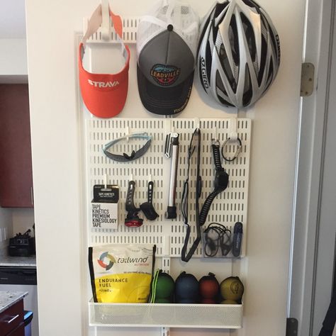 How I organize my running, cycling and swimming gear on the back of one door. | by Christen Dybenko | Medium Workout Gear Storage, Bike Gear Storage, Cycling Gear Storage, Bicycle Storage Rack, Running Room, Closet Organisation, Gear Wall, Cycle Storage, Swimming Gear