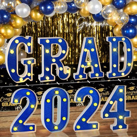 PRICES MAY VARY. 【Elevate Your Graduation Celebration】: Our LED Marquee Lights feature 8 individual letters spelling out "GRAD 2024", each measuring approximately 8.3*6.3*1.4 inches. With 6-8 mini bulbs per letter. These blue graduation party decoration 2024 can effortlessly enhance your graduation party or activities, adding an enchanting ambiance to your event under the glow of the glittering letters. 【Easy to Set up】: Crafted from high-quality plastic, these 2024 graduation decor ornaments ar Blue And Orange Graduation Party Ideas, Blue And White Graduation Party, Graduation Decorations Centerpieces, Graduation Colors, Blue Graduation Decorations, Light Up Letter, Blue Graduation Party, Graduation Centerpieces, Graduation Table Decorations