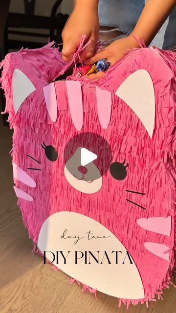 jennjoyceee on September 2, 2023: "No Squishmallow piñata available in stores? No problem! A little upcycle of cardboard boxes, some masking tape, streamers, and glue and voila! Here’s what we did ⬇️ 1. This is my first time making a piñata, so I stuck to an easy design and a single colour. 🪅💕 2. I made a stencil and cut the front and back of the piñata using a shipping box 📦 3. I used cereal boxes to cut out 3” strips for the sides and attached using masking tape. Cereal boxes are much mo Paper Mache Pinata Diy, How To Make A Pinata Diy, How To Make A Pinata, Paper Mache Art Projects, Paper Mache Pinata, Homemade Pinata, Mache Art, Diy Pinata, Cereal Boxes