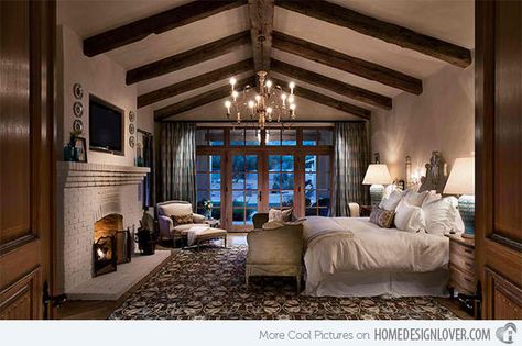 Bedrooms With Cathedral and Vaulted Ceilings | Home Design Lover.  Higgins Architects This bedroom is 17′x22″ and the ceiling height at the beam is approximately 11′-0″. The cathedral ceiling with exposed beam added a rustic appeal to the space. Romantic Bedroom Design, Design Seed, French Country Estate, Mediterranean Bedroom, Bedroom Fireplace, Romantic Bedroom, Hus Inspiration, Dreamy Bedrooms, Rustic Bedroom