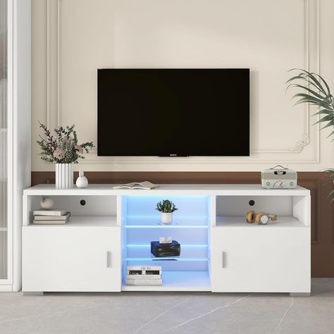 PRICES MAY VARY. [Open Glass Shelves]: The glass shelves are used in the middle of the TV cabinet, and the LED light increases the visual effect, expands the sense of storage space, showing your collections more coolly [Plug-in LED Lights]: The white small tv stand for 60 inch tv with storage is equipped with 16 RGB color change, 4 flashing modes and brightness adjustment function [Sturdy & Durable]: The led gaming entertainment center is made of thickened board, the surface is scratch-resistant Television Table, Small Tv Room, Game Room Bedroom, Small Tv Stand, Modern Tv Room, Small Tv, Bedroom White, Media Furniture, Tv Led