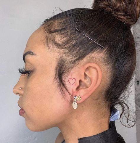 Female Small Face Tats, Heart Ear Tattoos For Women, Cute Tats Behind Ear, Heart Tattoo On Side Of Face, Baddie Tattoo Ideas Female Behind Ear, Small Tattoo By Ear On Face, Woman Behind Ear Tattoo, W A Y S Tattoo Behind Ear, Quotes Behind Ear Tattoo