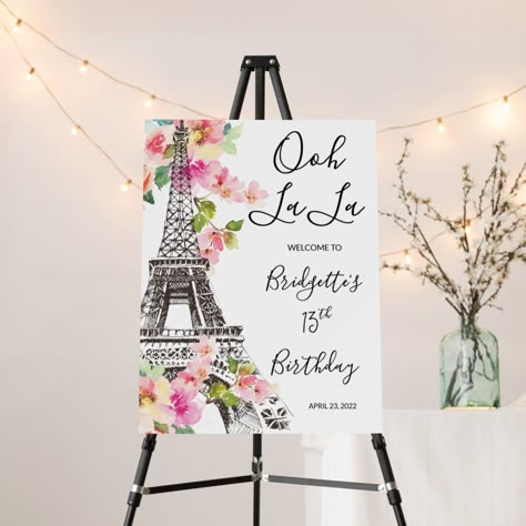 Start your Parisian event off with some french flare with this floral Paris themed welcome sign. Complete with a sketch of the Eiffel tower, guests are sure to say "ooh la la" as soon as they see it. Paris Themed Birthday Party For Adults, Paris Party Decorations Ideas, Paris Party Decorations Diy, Quinceanera Paris Theme, Paris Graduation Theme Party, Parisian Themed Party Decor, Paris Themed 1st Birthday Party, Paris Themed Dance, Paris Birthday Party Ideas Decoration