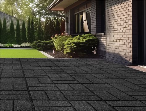 Elevate your outdoor space with GroundSmart SmartLoc Rubber Pavers. Made from 100% recycled rubber, these pavers are not only sustainable but also durable and long-lasting. With SmartLoc connecting system, installation is quick and secure, allowing you to create a beautiful new patio or deck. Plus, these pavers won't freeze or crack, making them the perfect choice for any DIY enthusiast looking for a low-maintenance option. Rubberific 16-in L x 16-in W x 0.625-in H Square Black Smartloc Rubber Paver Multi-pack | DCPV16ILBK9 Rubber Mulch Patio, Patio Ground Ideas, Easy Backyard Ideas On A Budget, Yard Tiles, Recycled Rubber Pavers, Cheap Walkway Ideas Diy, Rubber Walkway, Mulch Alternatives, Outdoor Rubber Flooring