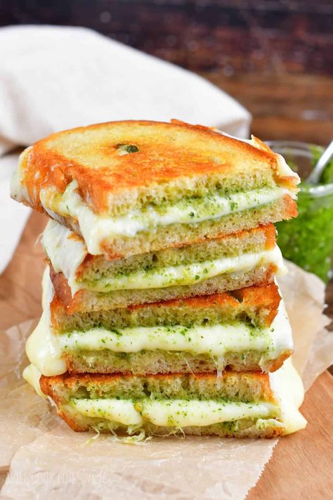 Pesto Grilled Cheese is the ultimate easy sandwich for pesto lovers! Gooey mozzarella and provolone cheeses are complimented by vibrant basil pesto between two buttery slices of warm bread. Mozzarella And Pesto Sandwich, Grilled Cheese And Pesto Sandwich, Basil Pesto Grilled Cheese, Healthy Grilled Cheese Sandwich, Mozzarella Sandwich Recipes, Basil Pesto Sandwich, Pesto Mozzarella Sandwich, Grilled Cheese In Oven, Pesto Cheese Sandwich