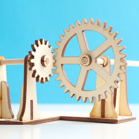 Laser cut right angle gear mechanism. The axels are made from wooden dowels. Marble Machine, Gear Design, Wooden Gears, Mechanical Gears, Beer Fridge, Bevel Gear, Laser Ideas, Nuts Bolts, Kinetic Art