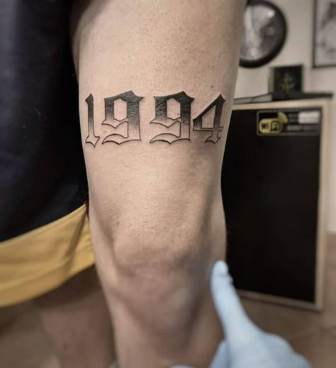 101 Amazing Number Tattoo Ideas To Inspire You In 2023! - Outsons|#tattoo #handtattoo #tattoos #rosetattoo #tattoorose 498 2020 Tattoo Number, 2002 Tattoo Ideas For Men, 2002 Tattoo Font, Number Tattoo Men, Tattoo Numbers Ideas, 1994 Tattoo Ideas, 2002 Tattoo Ideas, Tattoo Numeros, Numbers Tattoo Ideas