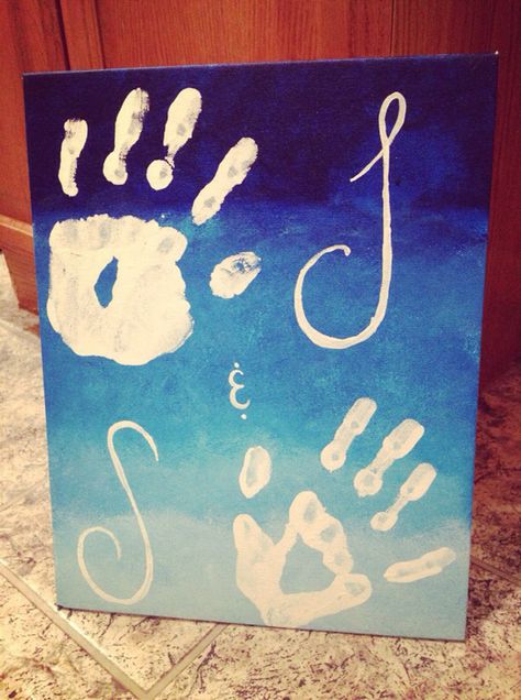 Using a canvas board, I took a damp sponge and started with a dark blue paint, mixing it with white as I worked my way down the board. I was attempting to give it an ombré look. Then my boyfriend and I painted our hands white and stamped them on the board, and I painted our first initials beside of our hands. It was really easy and a cute idea! Couples Painting Ideas Canvases Hands, Marriage Painting Ideas, Cute Paintings To Do With Boyfriend, Couple Easy Painting Ideas, Hand Paintings For Couples, Painting Ideas To Do With Boyfriend, Blue Paintings On Canvas Easy, Cute Couple Canvas Painting Ideas Easy, Painting Ideas On Canvas With Boyfriend