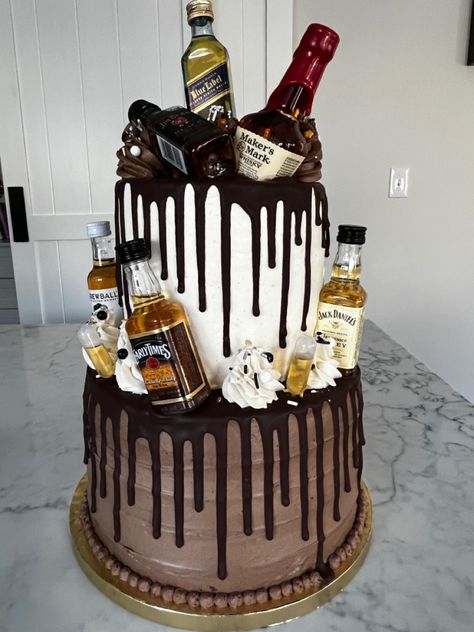 2 tier booze cake. Chocolate cake bottom tier with whiskey pipettes. Vanilla top tier. Birthday Cakes For 55 Year Old Men, Bourbon Birthday Cake Design, Whiskey Themed Birthday Cake, Bourbon Cake Design, Cake With Alcohol Bottles On Top, Whiskey Cake Design, Beetlejuice Decorations, Whiskey Cake Recipe, Liquor Cakes