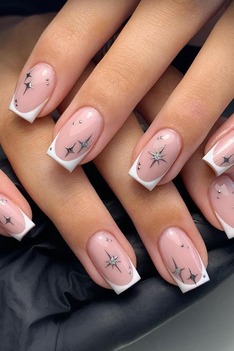 Channeling celestial beauty with French Tips adorned in delicate star constellations, this dreamy manicure combines a soft pink base with minimalist silver designs. The sparkling accents add a touch of enchantment to create a perfect, starry night-inspired look. // Photo Credit: Instagram @glamnails_bymeg January Nail, January Nail Designs, Star Nail Designs, Silver Nail Designs, January Nails, Subtle Nails, Simple Gel Nails, Work Nails, French Tip Acrylic Nails