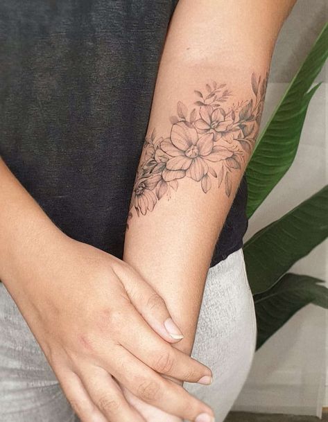 70 Beautiful Flower Tattoo Ideas for Women in 2023 Arm Wrap Tattoo, Floral Arm Tattoo, Simple Flower Tattoo, Around Arm Tattoo, Flower Bouquet Tattoo, Forearm Flower Tattoo, Wrap Tattoo, Flower Wrist Tattoos, Bouquet Tattoo