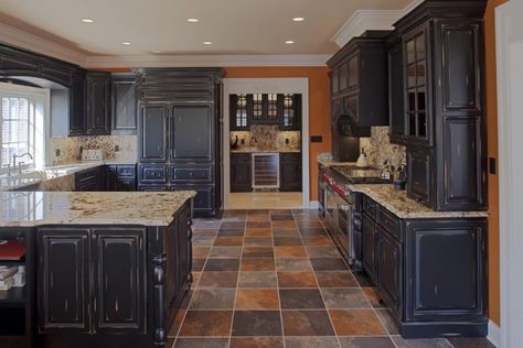 traditional kitchen with distressed black cabinets Black Distressed Cabinets, Tudor Remodel, Milk Paint Kitchen Cabinets, Slate Floor Kitchen, Distressed Kitchen Cabinets, Slate Kitchen, Distressed Cabinets, Distressed Kitchen, Kitchen Cupboards Paint