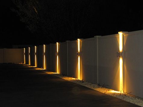 Is It Possible To Light Up Your Fence? - Straight Line Fence Outside Lights On Fence, Fence Wall Lighting Ideas, Lights On Side Of House, Light On Wall Ideas, Lights For Fence Posts, Modern Fence Lighting, Fence With Lighting, Fencing Lighting Ideas, Garden Fence Lighting