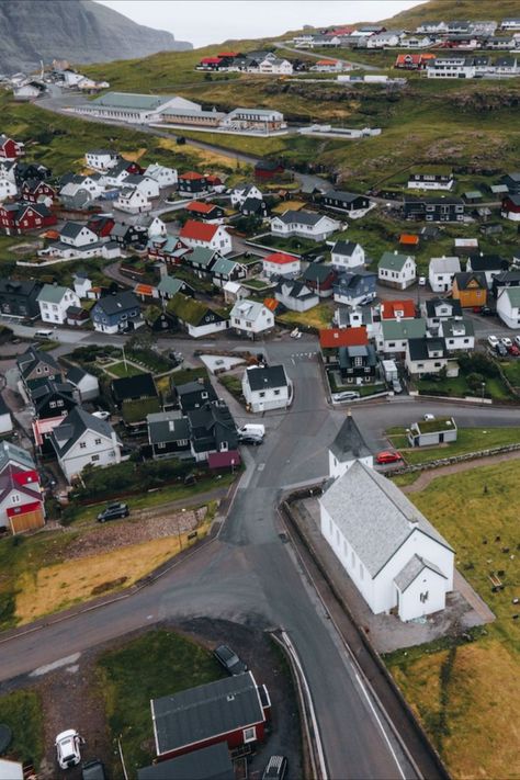 The island of Eysturoy (meaning 'East Island') is located within the Faroe Islands archipelago, which is owned by Denmark. It is the 2nd largest and most populated island in the country, containing the villages of Eiði and Gjógv to the north, the basalt sea stacks Risin og Kellingin, Slættaratindur - the highest mountain in Faroe, and the fjords Skálafjørður and Funningsfjørður. Faroe Islands Denmark, The Villages, Faroe Islands, Archipelago, Europe Travel, Denmark, Travel