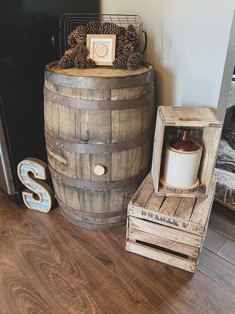 Whiskey Barrel Ideas Indoor, Whiskey Barrel Basement, Wine Barrel Decorations, Whiskey Barrel Home Decor, Antique Whiskey Jug Decor Ideas, Wine Barrel Porch Decor, Repurposed Wine Barrel, Wooden Barrel Decor, Whiskey Barrel Porch Ideas